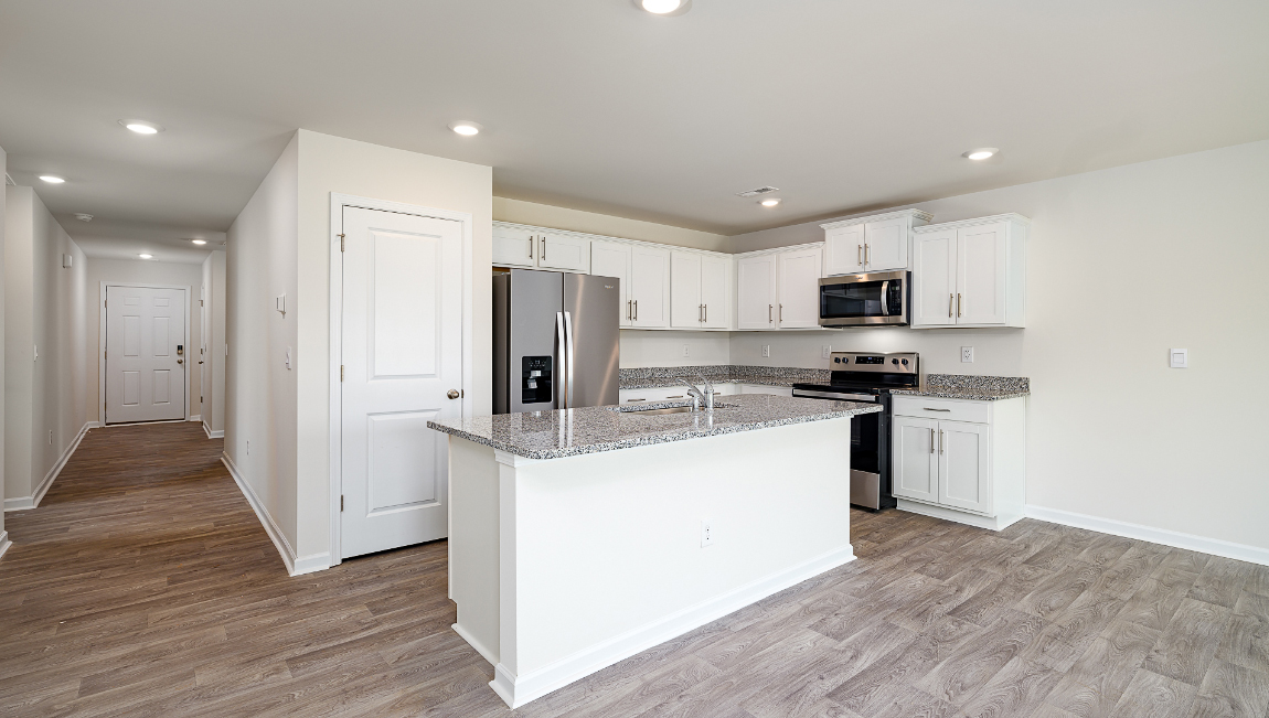 Open kitchen and island with white cabinets