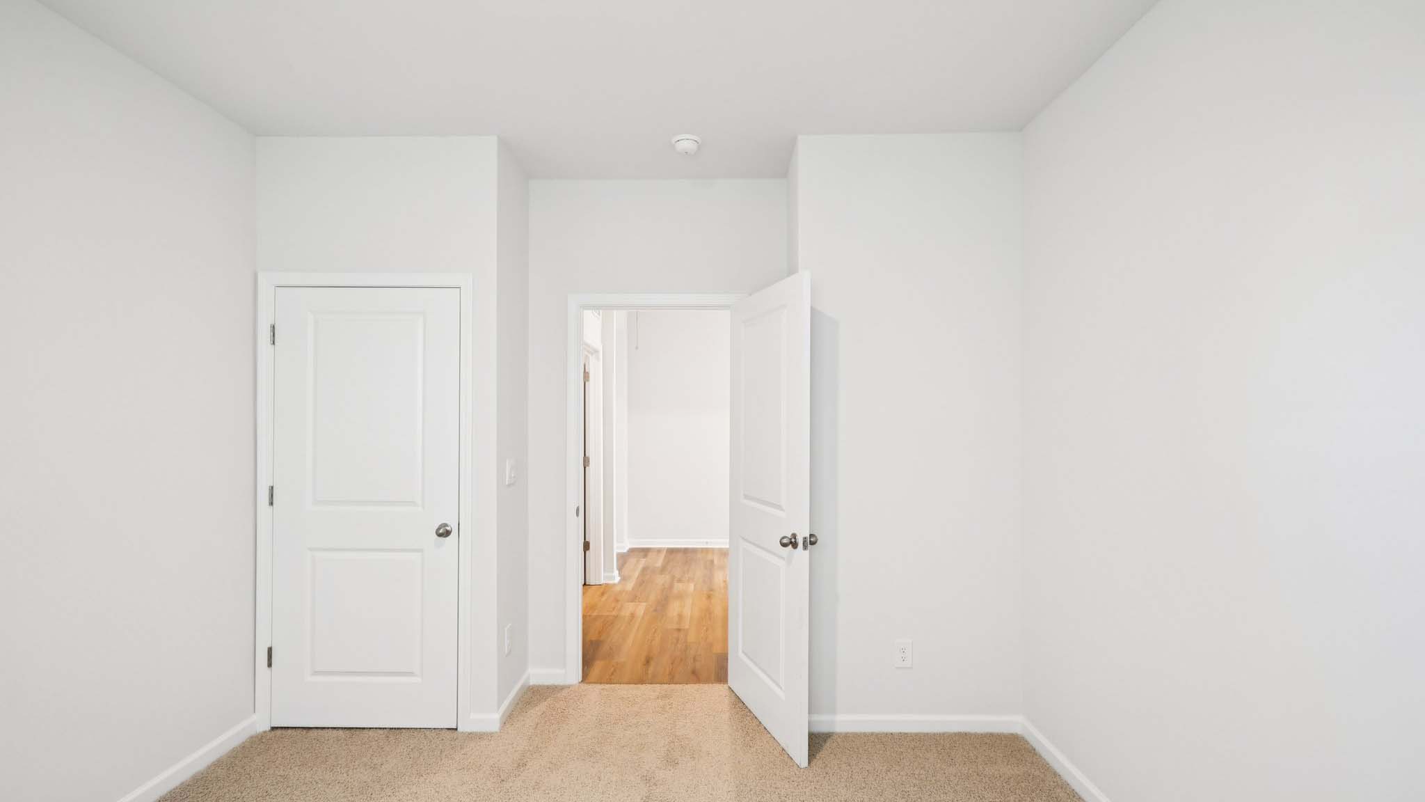 Primary bedroom with large windows