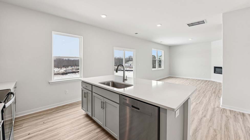 kitchen and island with stainless steel appliance