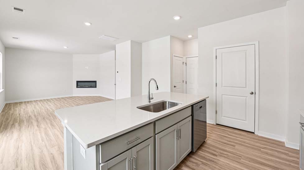 kitchen and island with stainless steel appliance