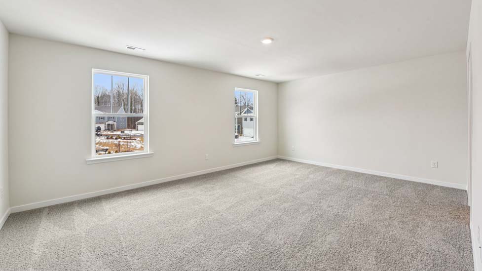 Carpeted bedroom with large window