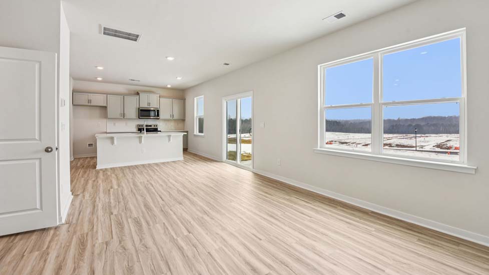 Living room with electric fireplace and large window