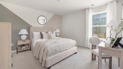 carpeted bedroom with large windows. new homes in charlotte, nc