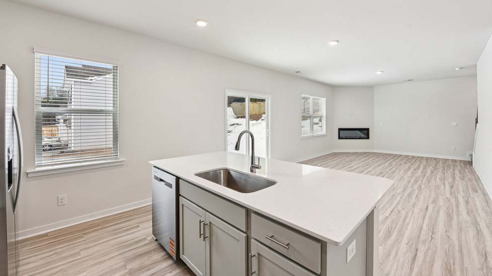 Kitchen and island with stainless steel appliances