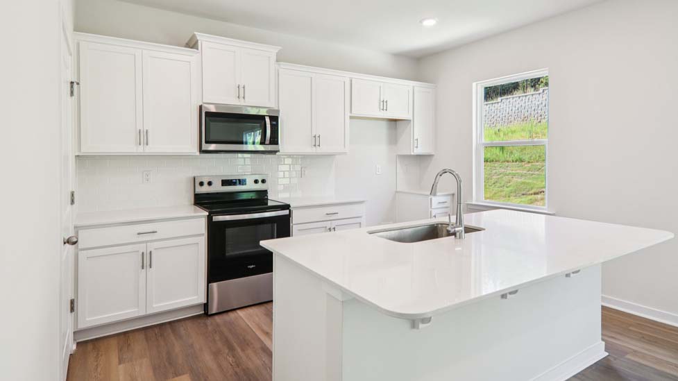 kitchen and island with stainless steel appliances