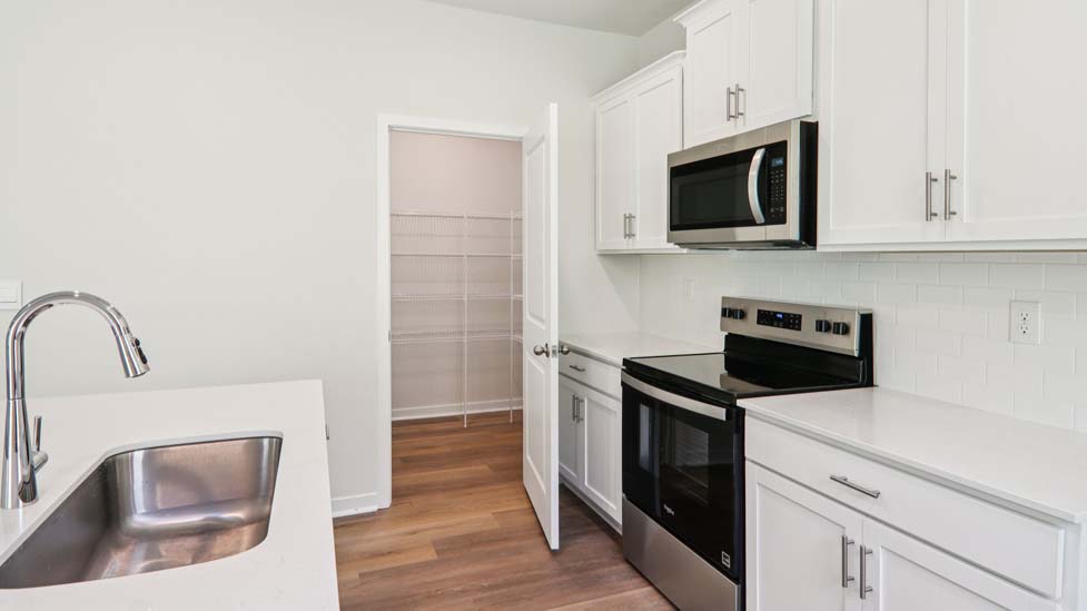 kitchen and island with stainless steel appliances
