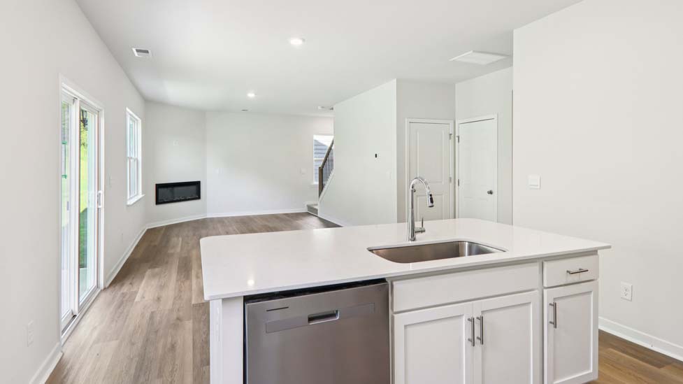 kitchen and island with stainless steel appliances