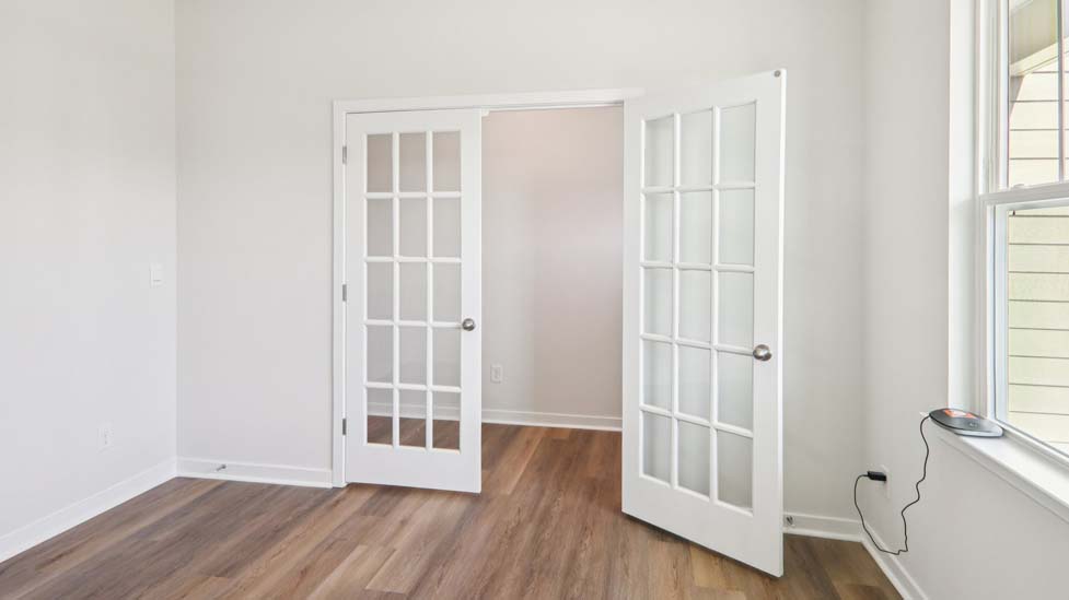 Dining area with large window and french doors