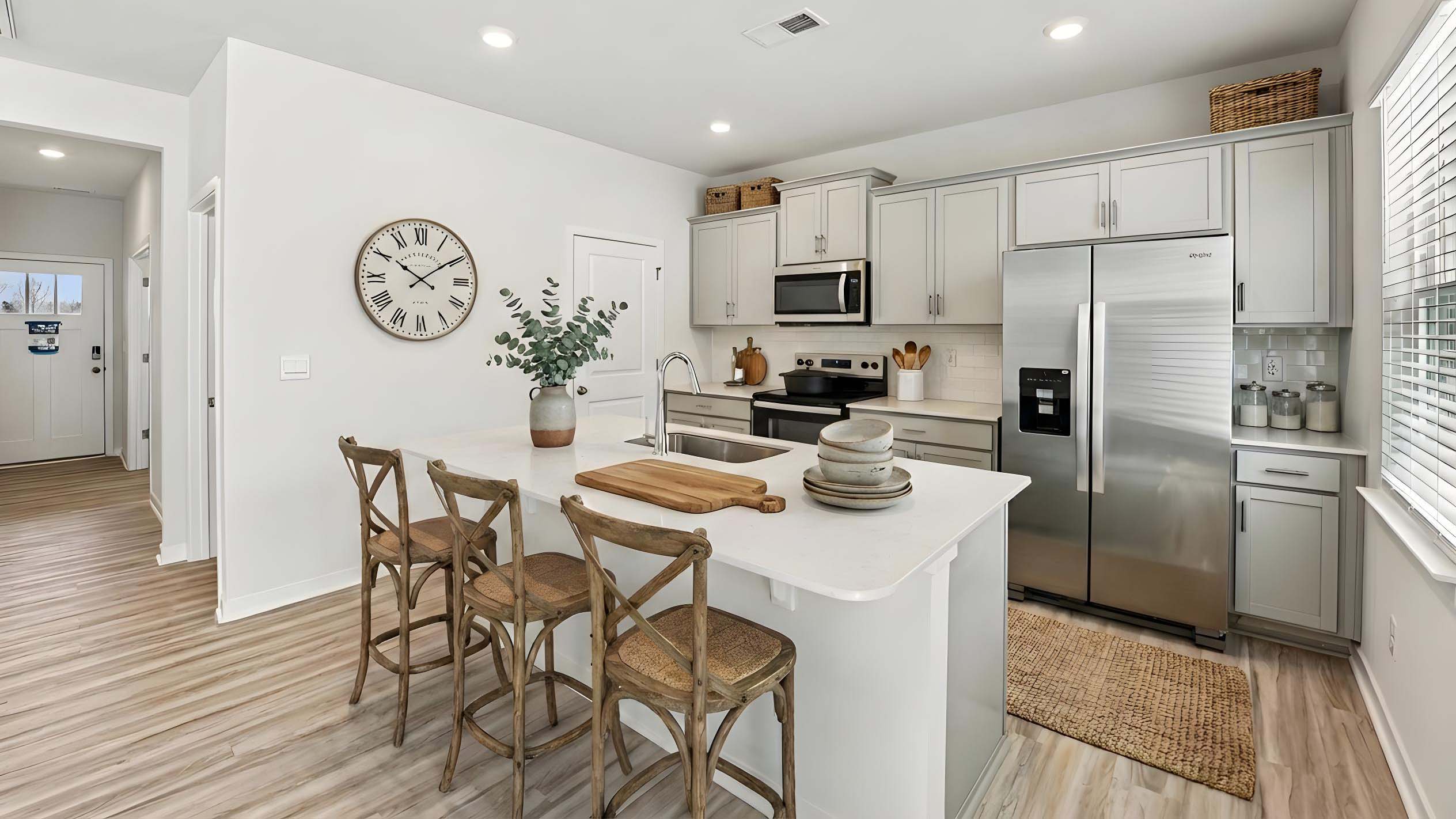 Kitchen and island with stainless steel appliances