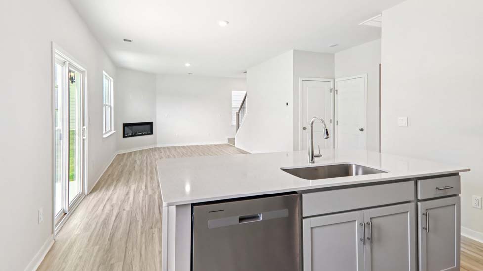 kitchen and island with stainless steel appliances