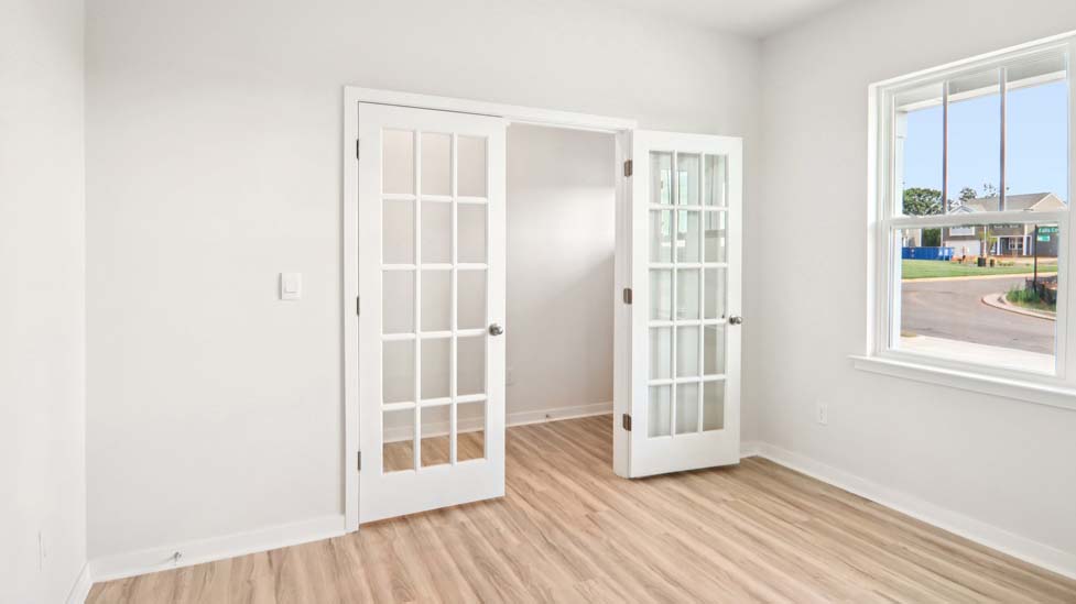 Dining area with large window and french doors