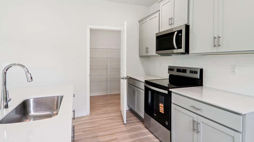 kitchen and island with stainless steel appliances