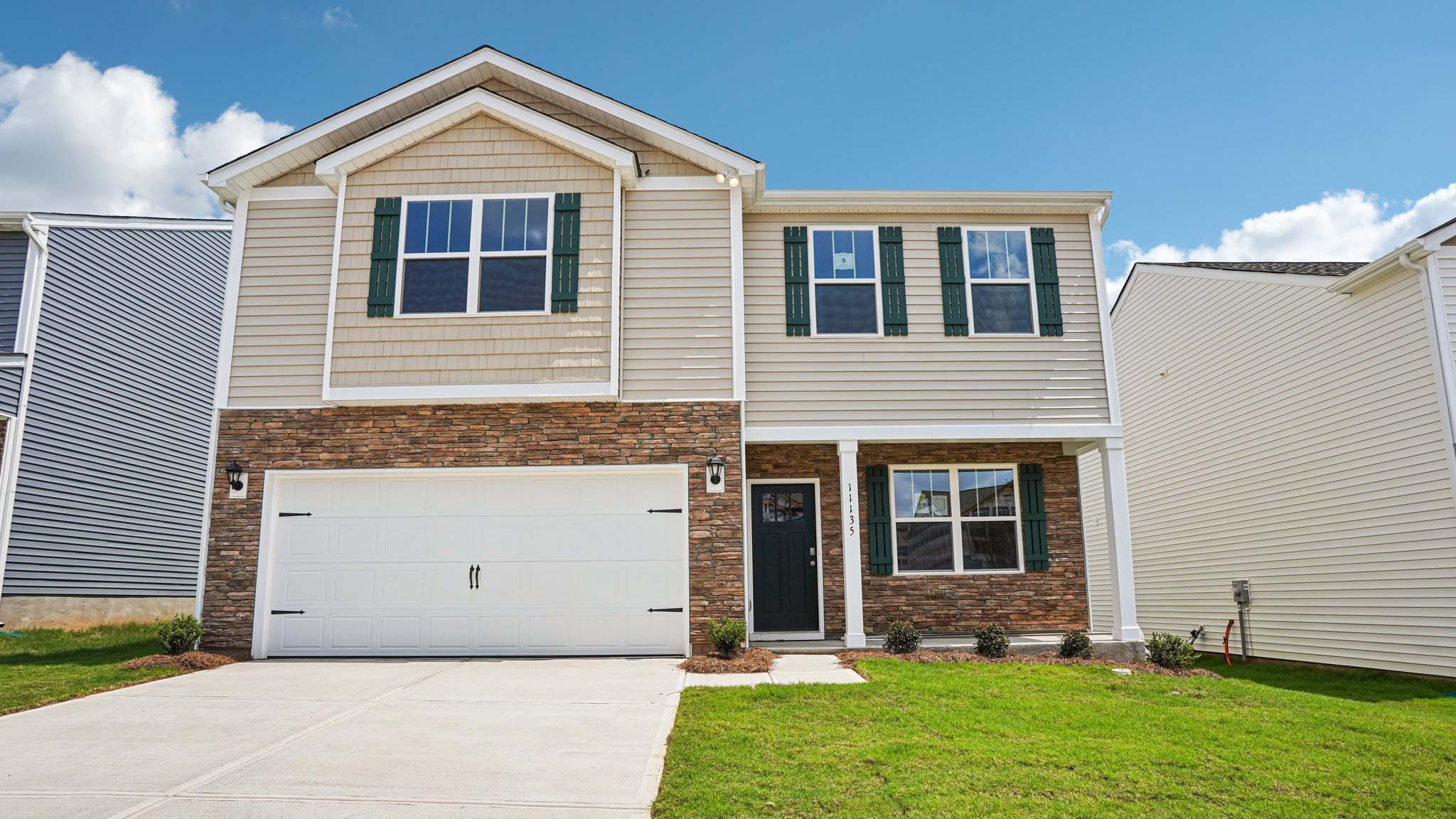 Penwell front exterior with two car garage