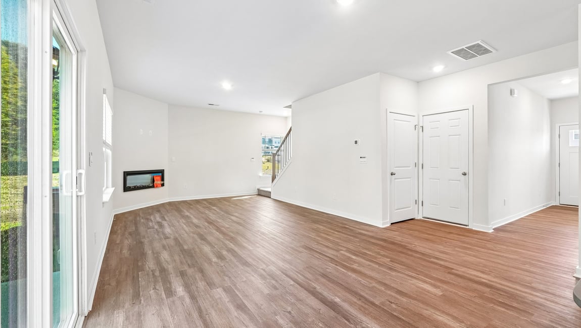 Family room with fireplace and large window