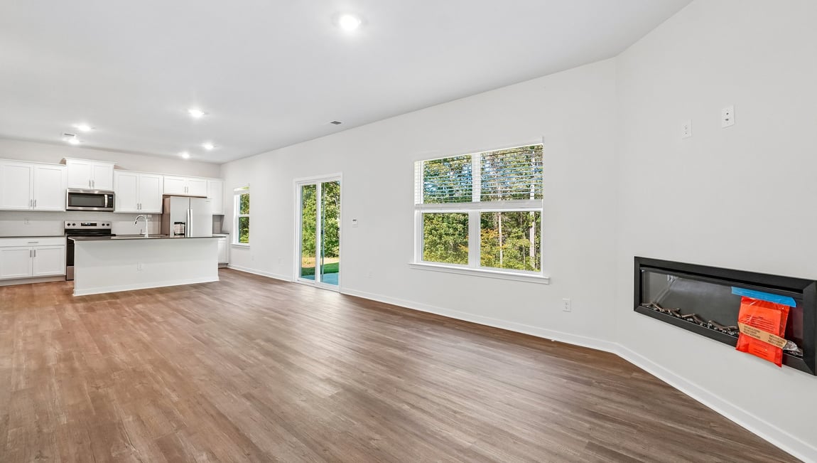 Family room with fireplace and large window