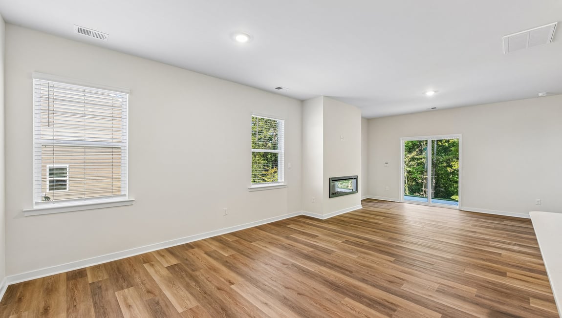 Family room with fireplace and large window