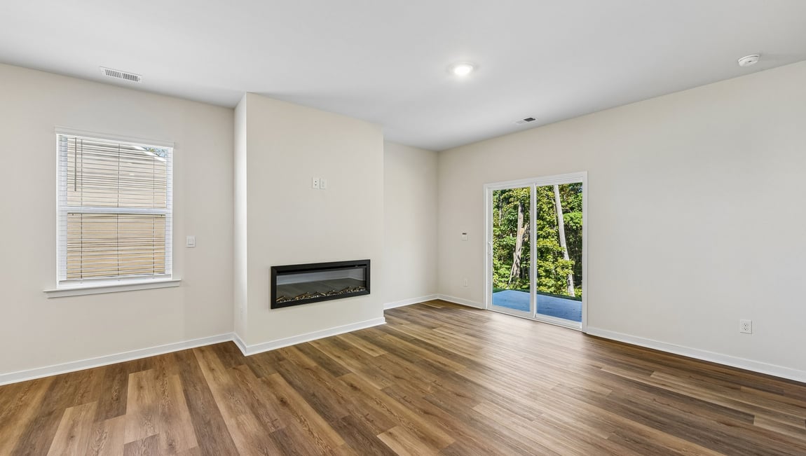 Family room with fireplace and large window