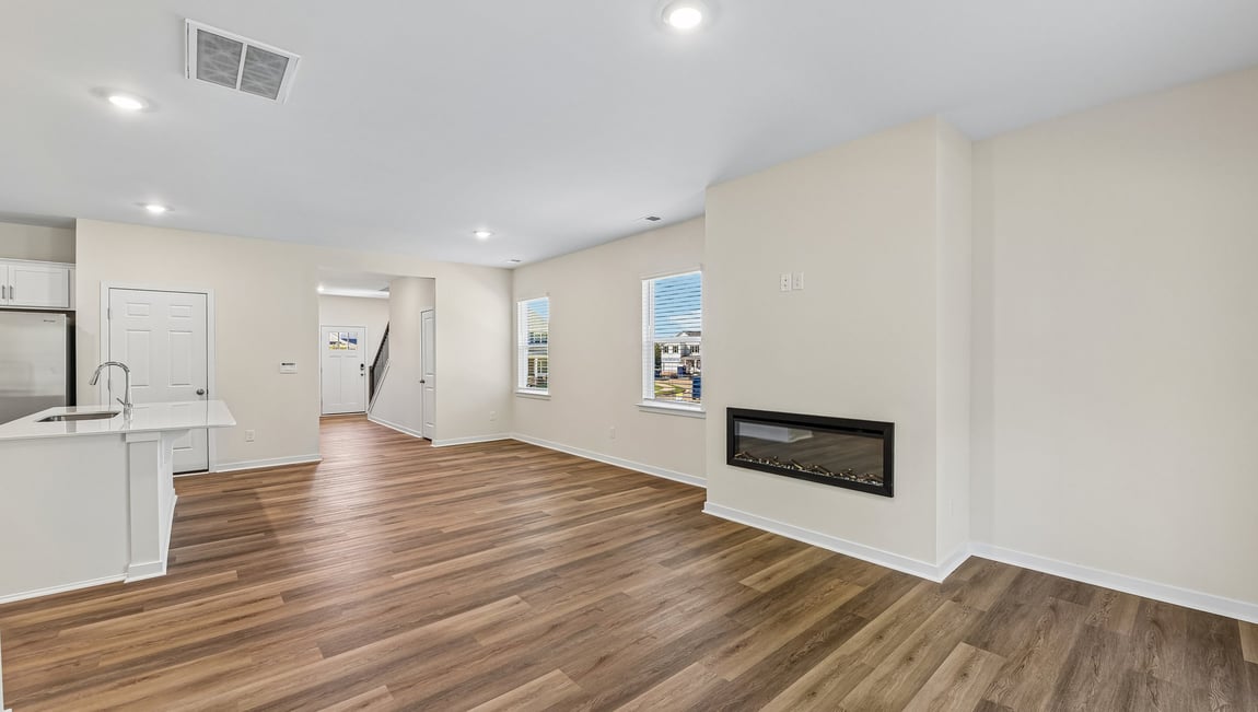 Family room with fireplace and large window