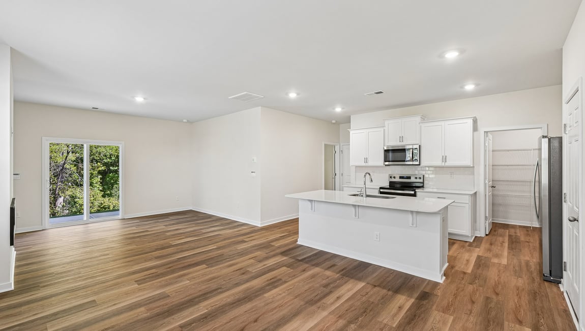 Family room with fireplace and large window