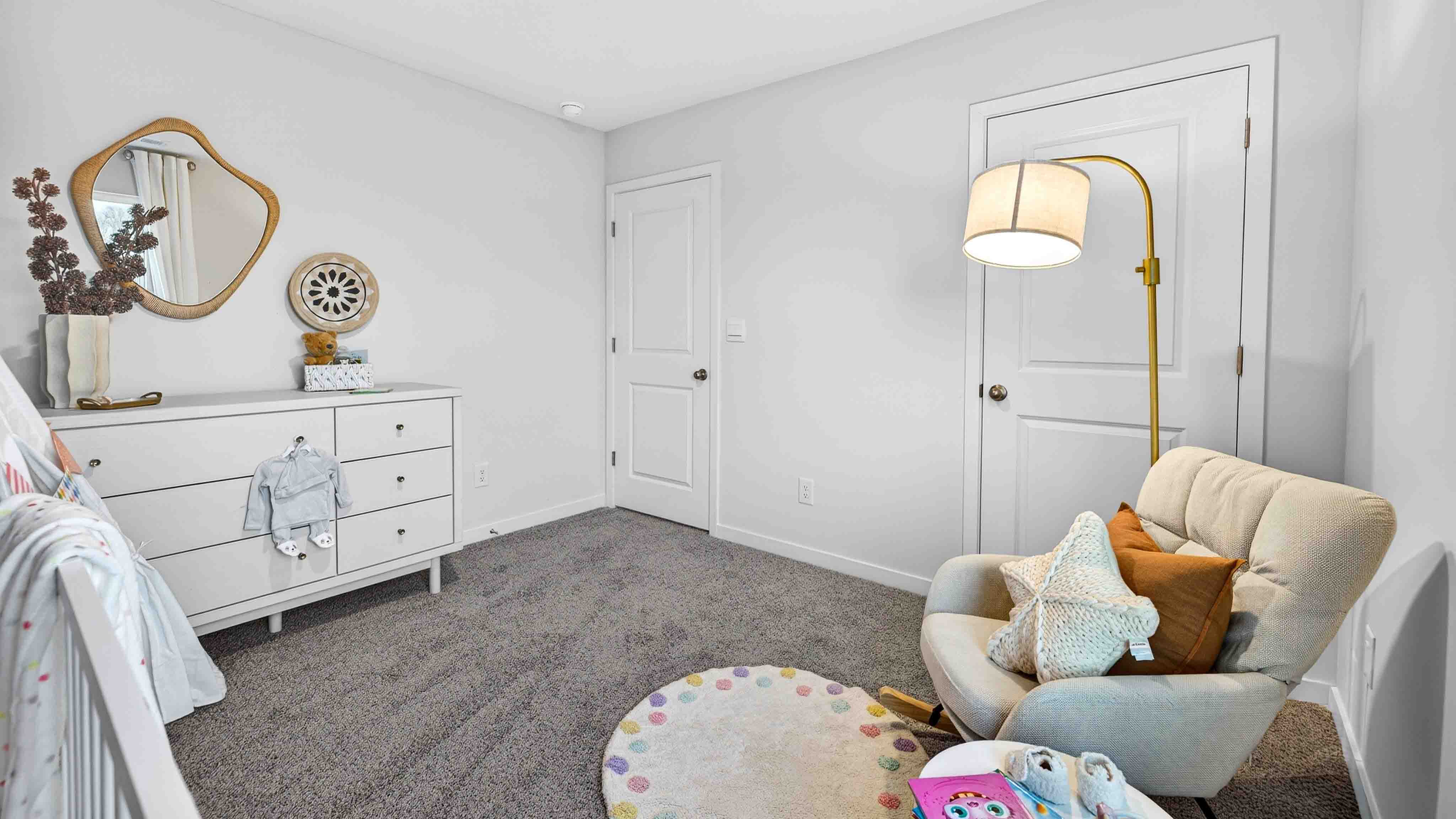 Carpeted bedroom with large window