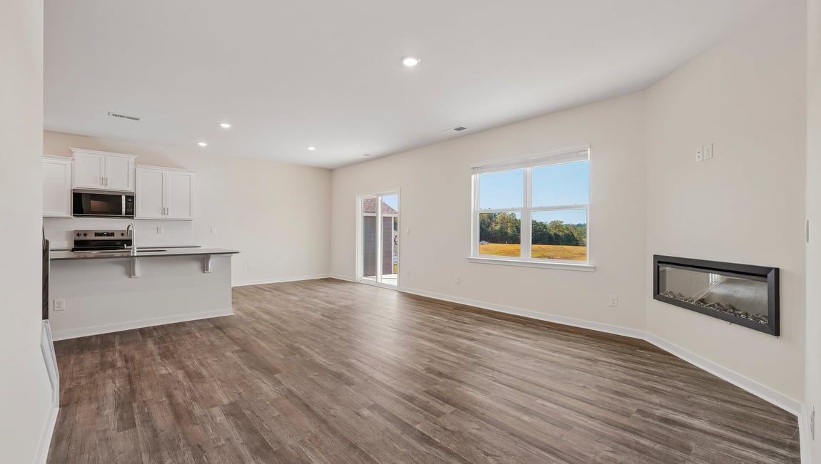 Living room with windows and electric fireplace