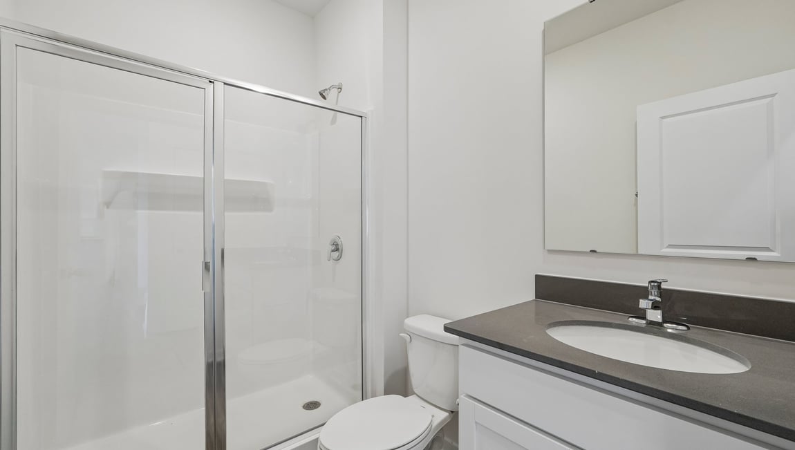 Bathroom with standing glass shower