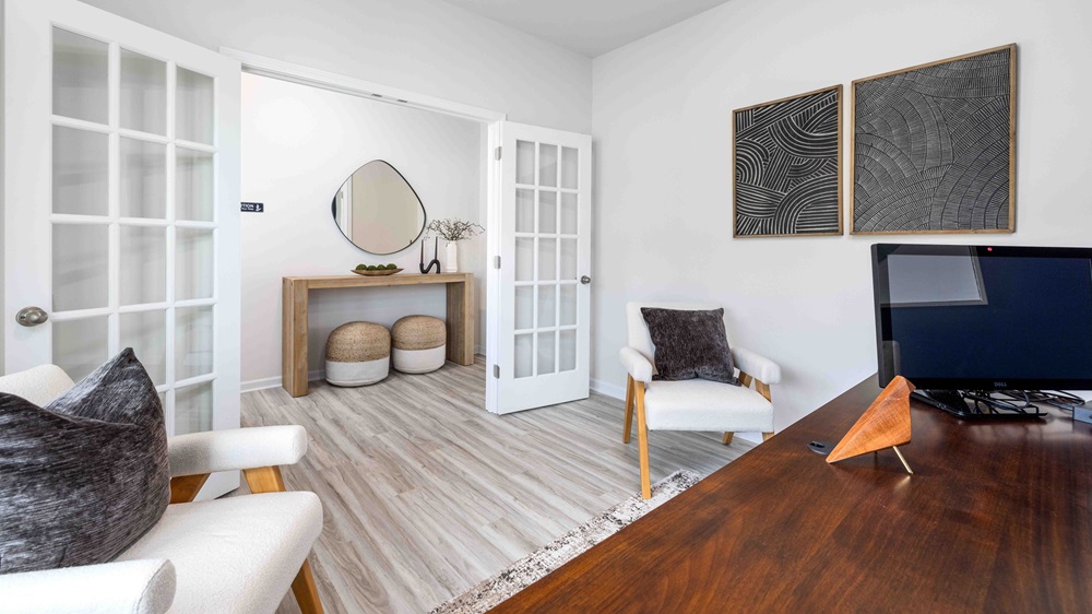 Carpeted bedroom with windows