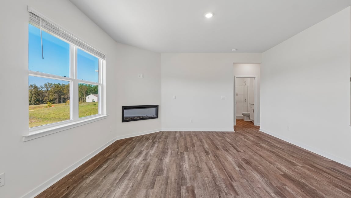 Living room with windows and electric fireplace