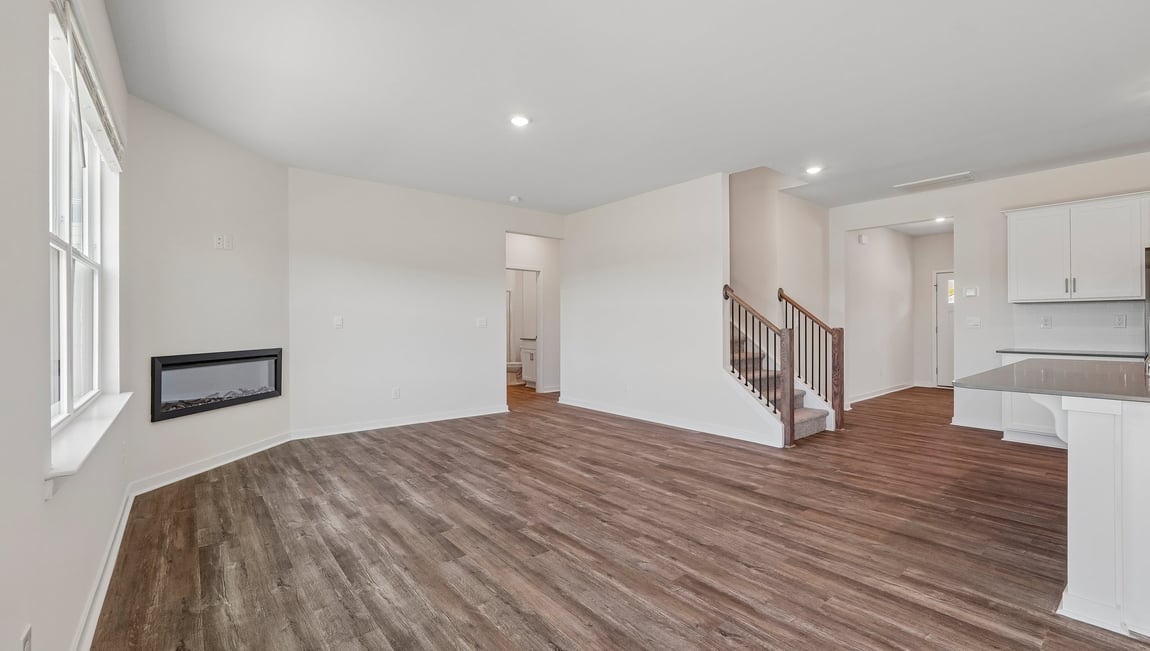 Living room with windows and electric fireplace