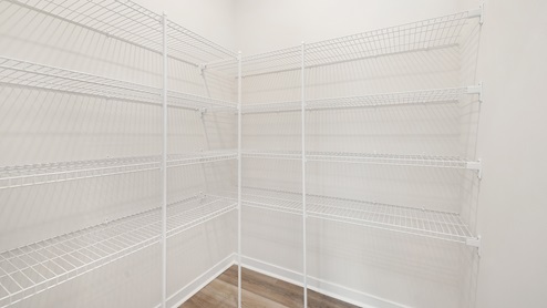 kitchen pantry with storage racks. new home in charlotte, nc