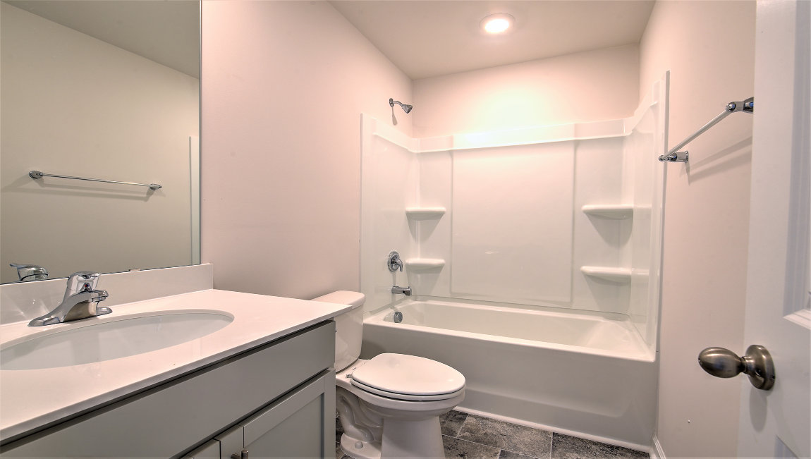 Bathroom with bathtub and shower combination