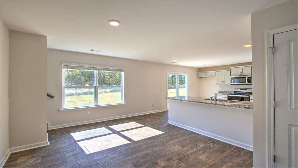 Dining room with vinyl floors, and large window