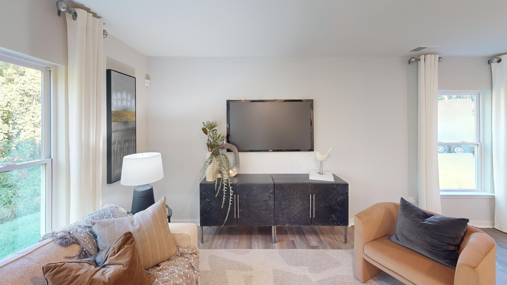 Open living room by kitchen and stairs