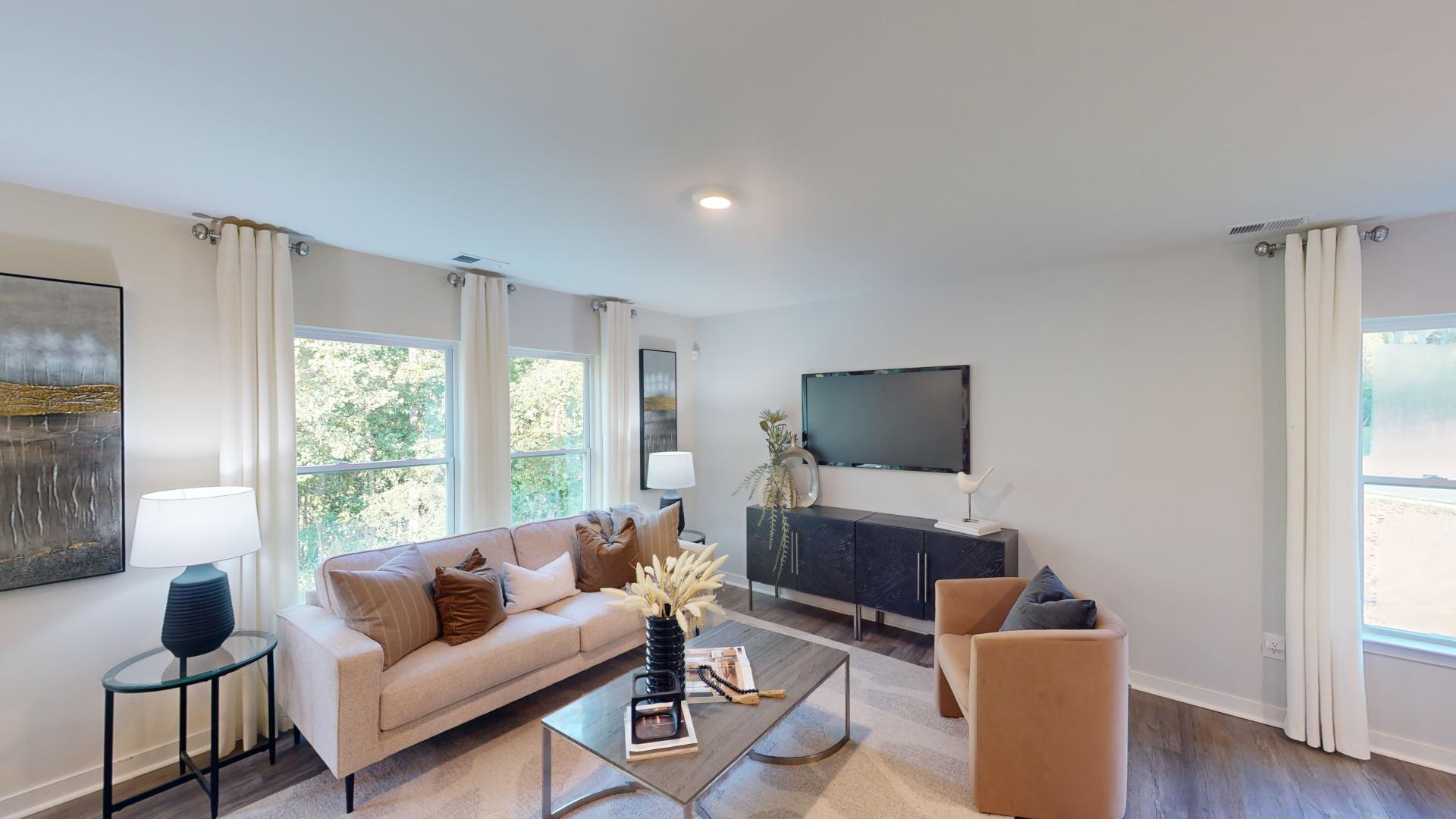 Open living room by kitchen and stairs