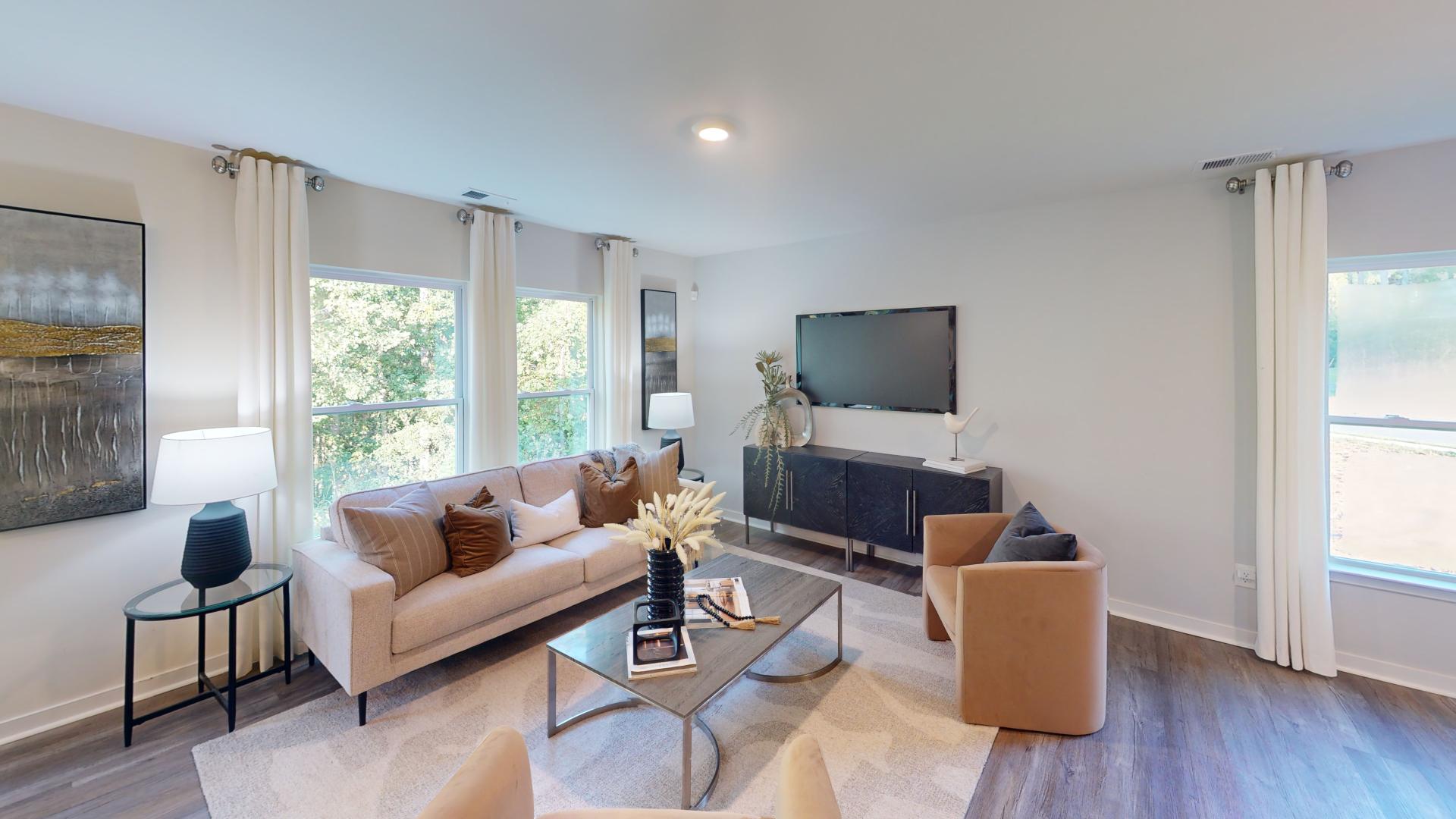 Open living room by kitchen and stairs
