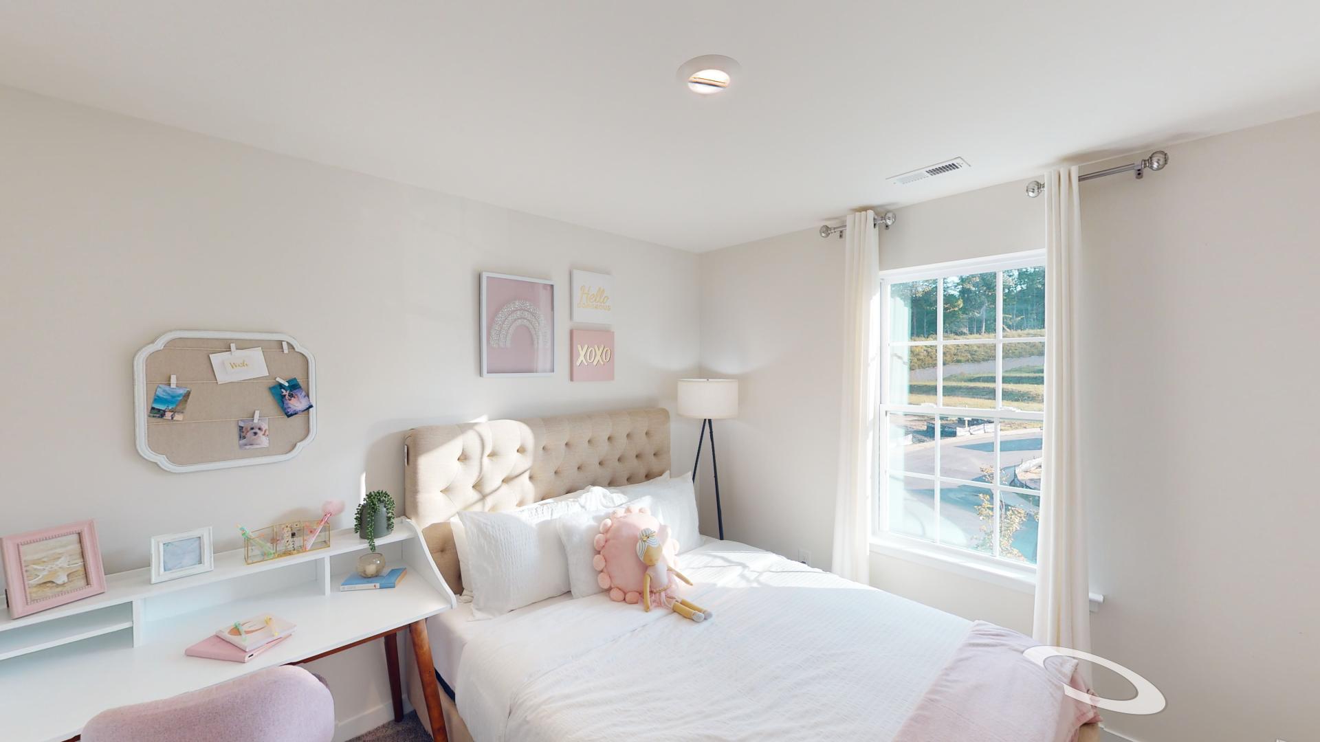 Carpeted bedroom with small windows