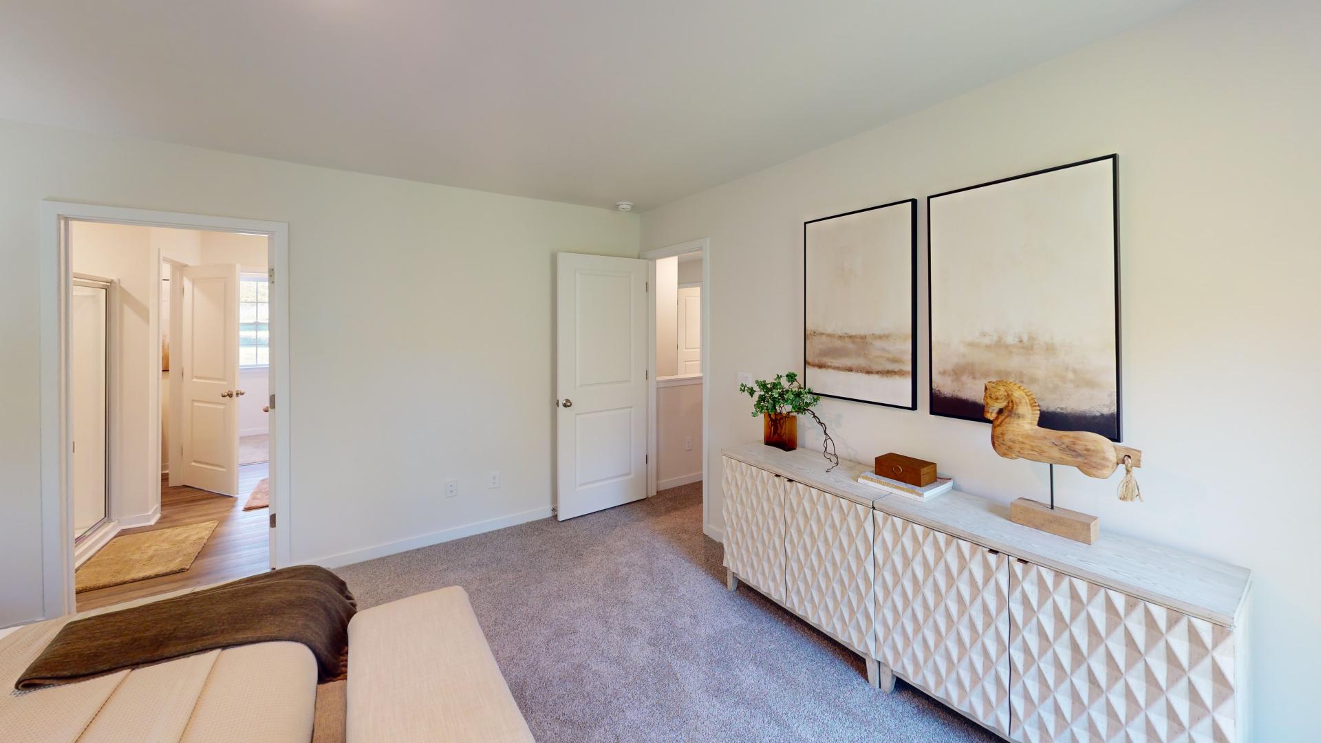 Carpeted bedroom with small windows