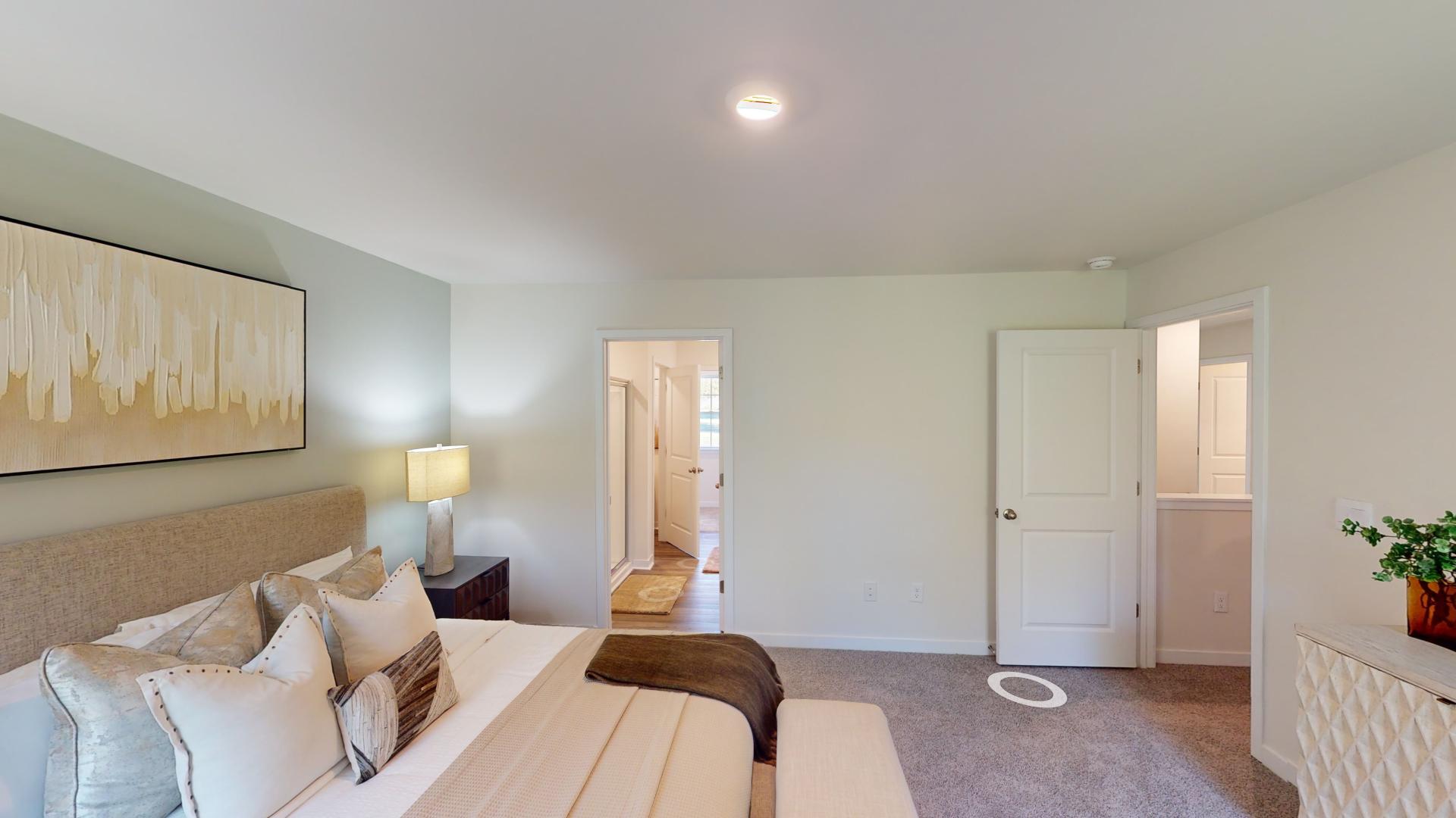 Carpeted bedroom with small windows