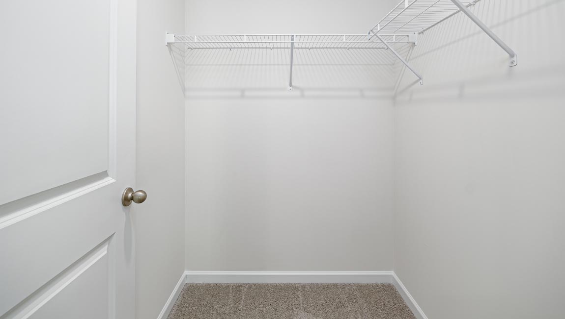 Carpeted walk in closet