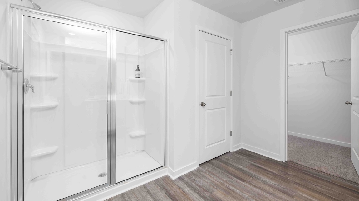 Primary bathroom with glass door shower