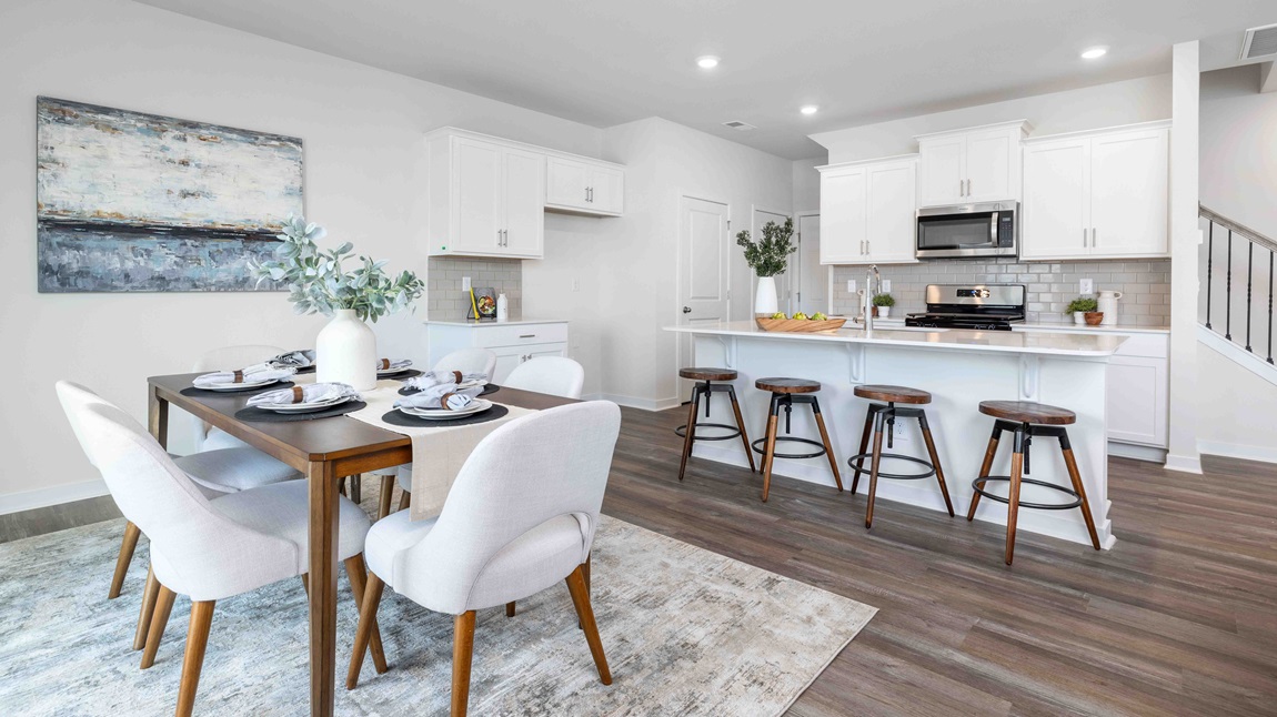 Open dining area near kitchen, with sliding glass doors