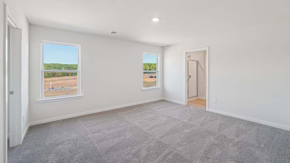 Carpeted bedroom with window