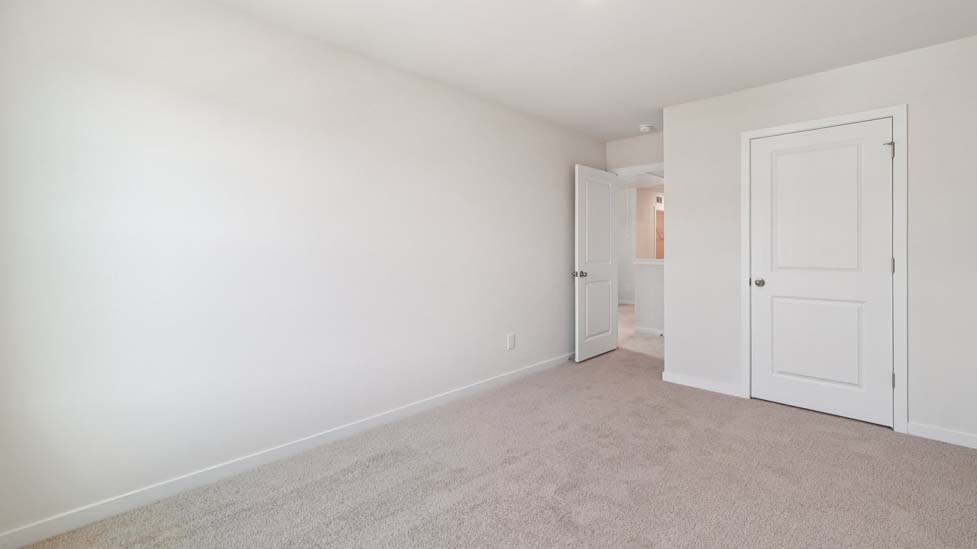 Carpeted bedroom with window