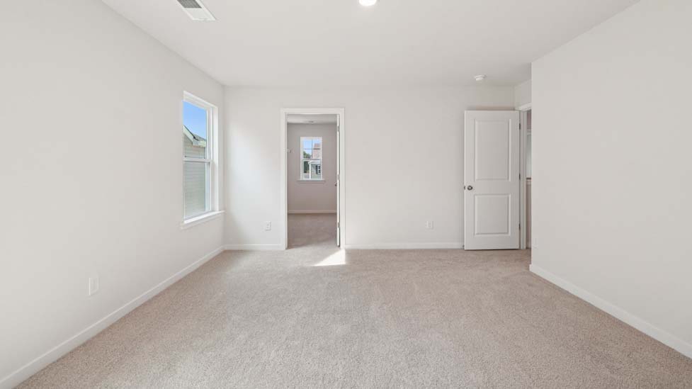 Primary bedroom with windows