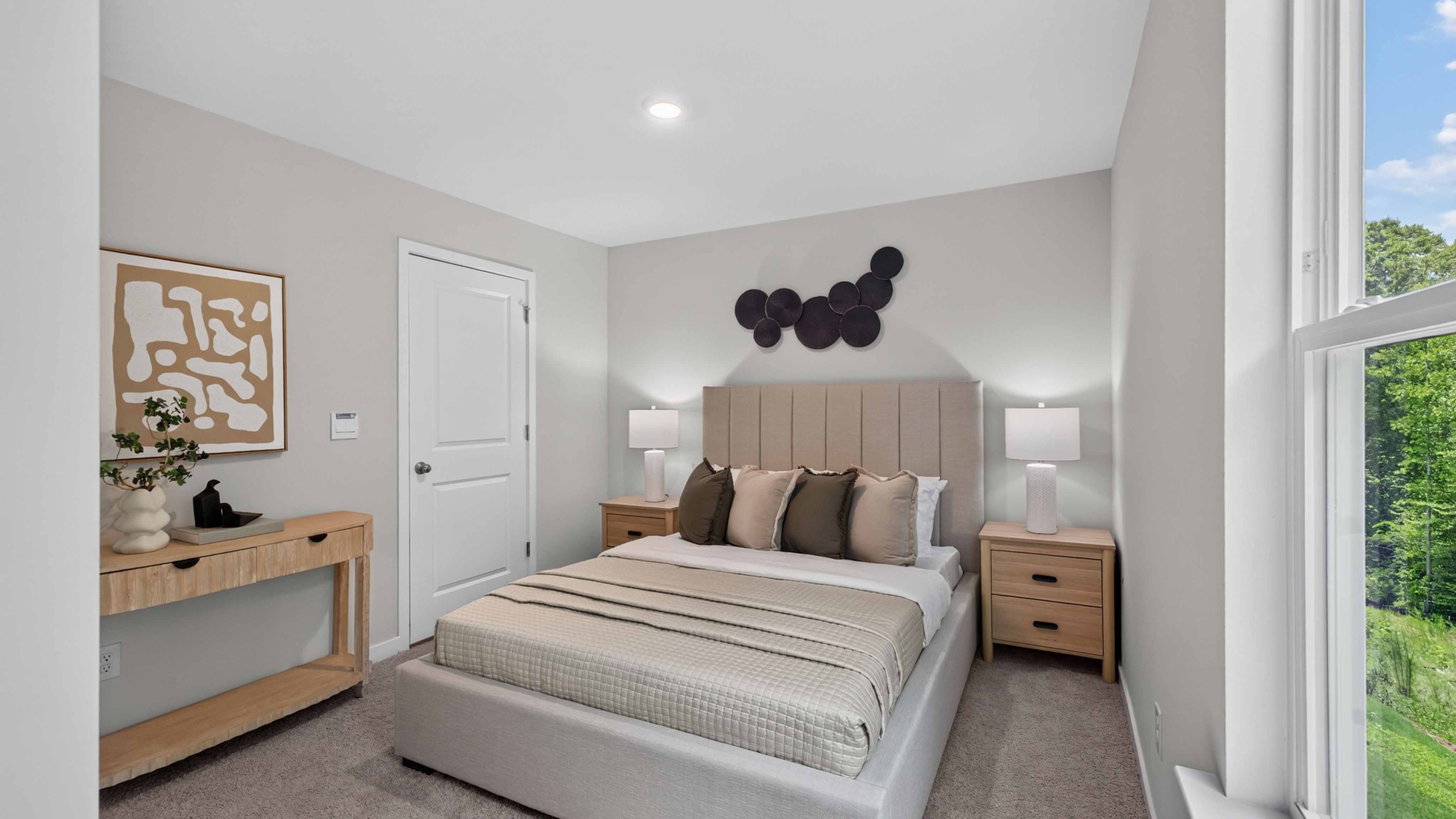 Carpeted bedroom with large window