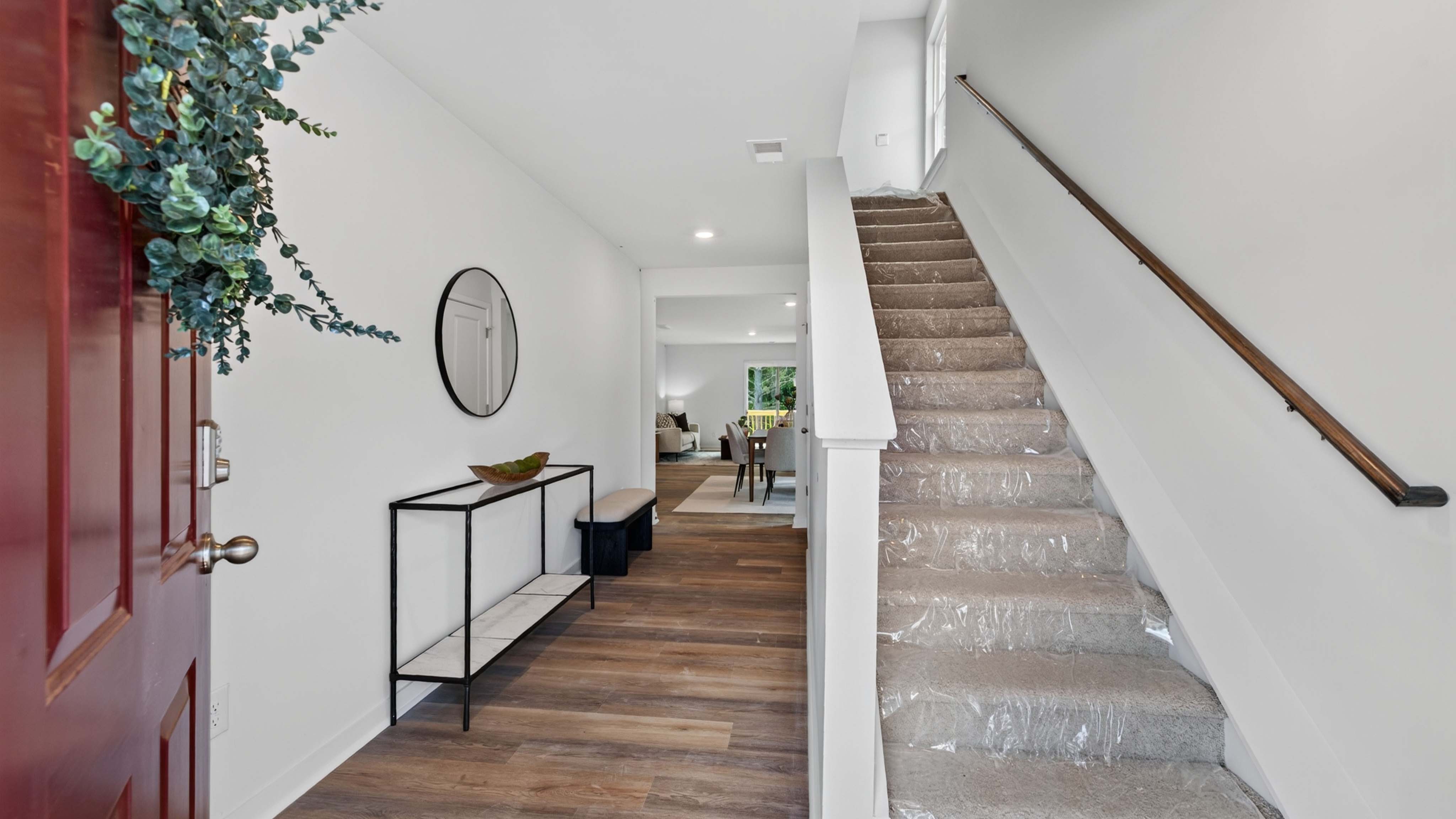 Welcoming foyer view of staircase