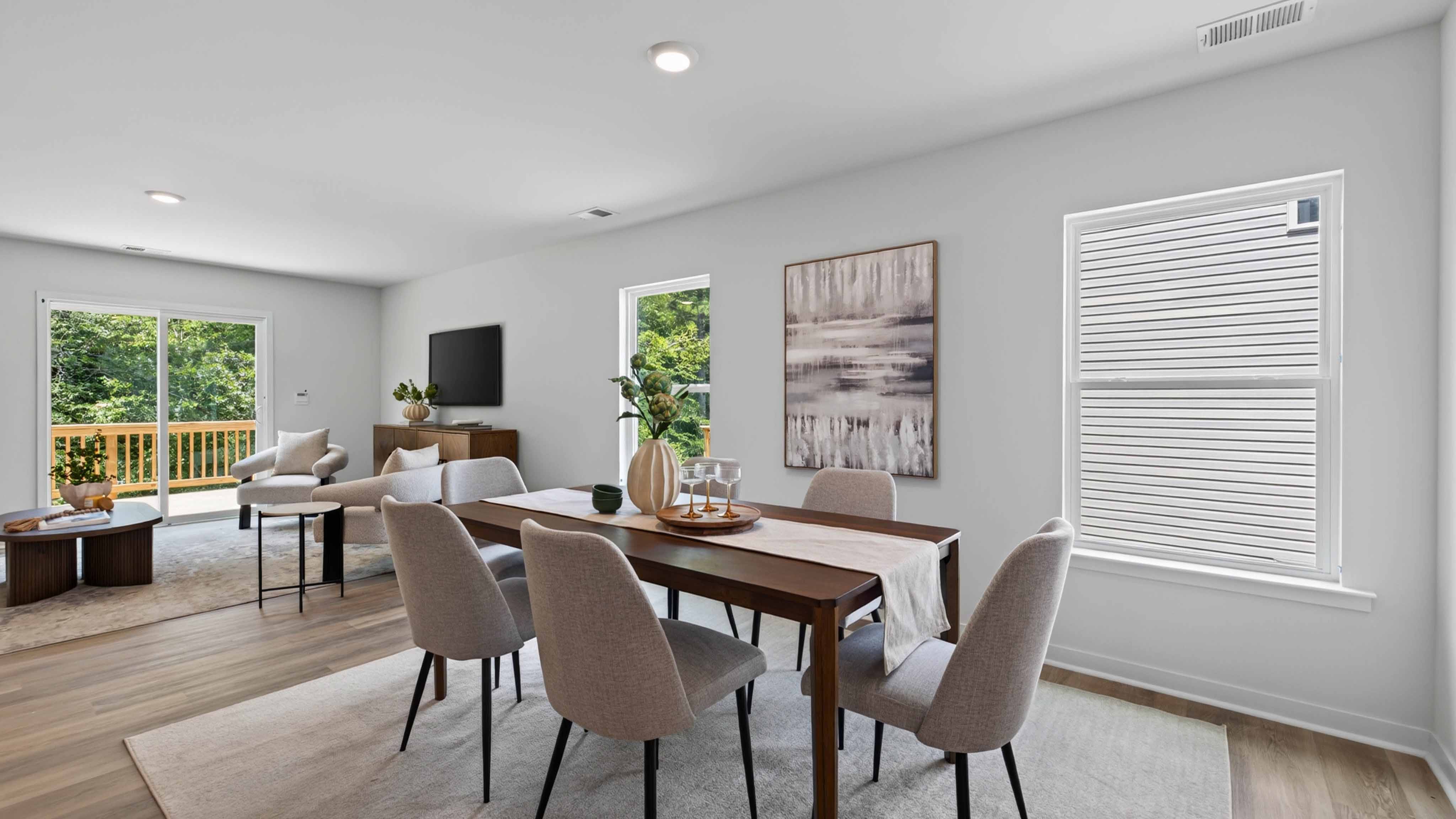 Dining Room in view of family room, wood floors, two windows alongside