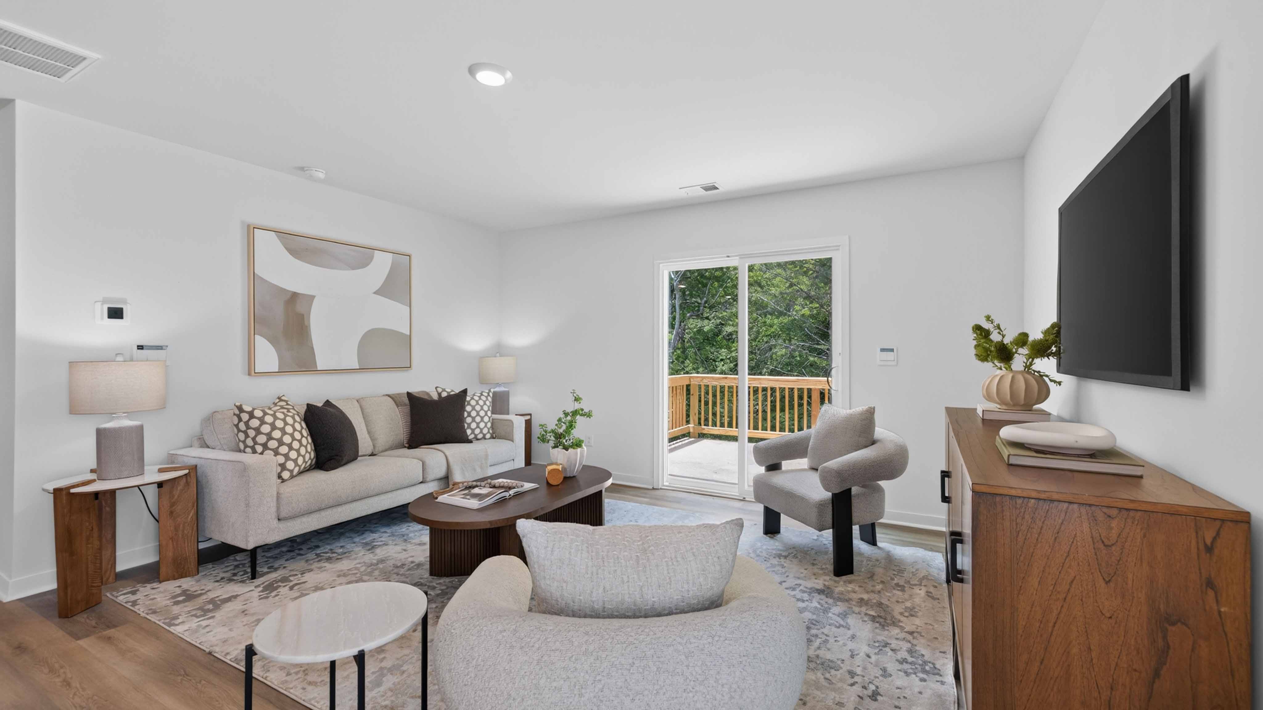 Family room with fireplace and large window