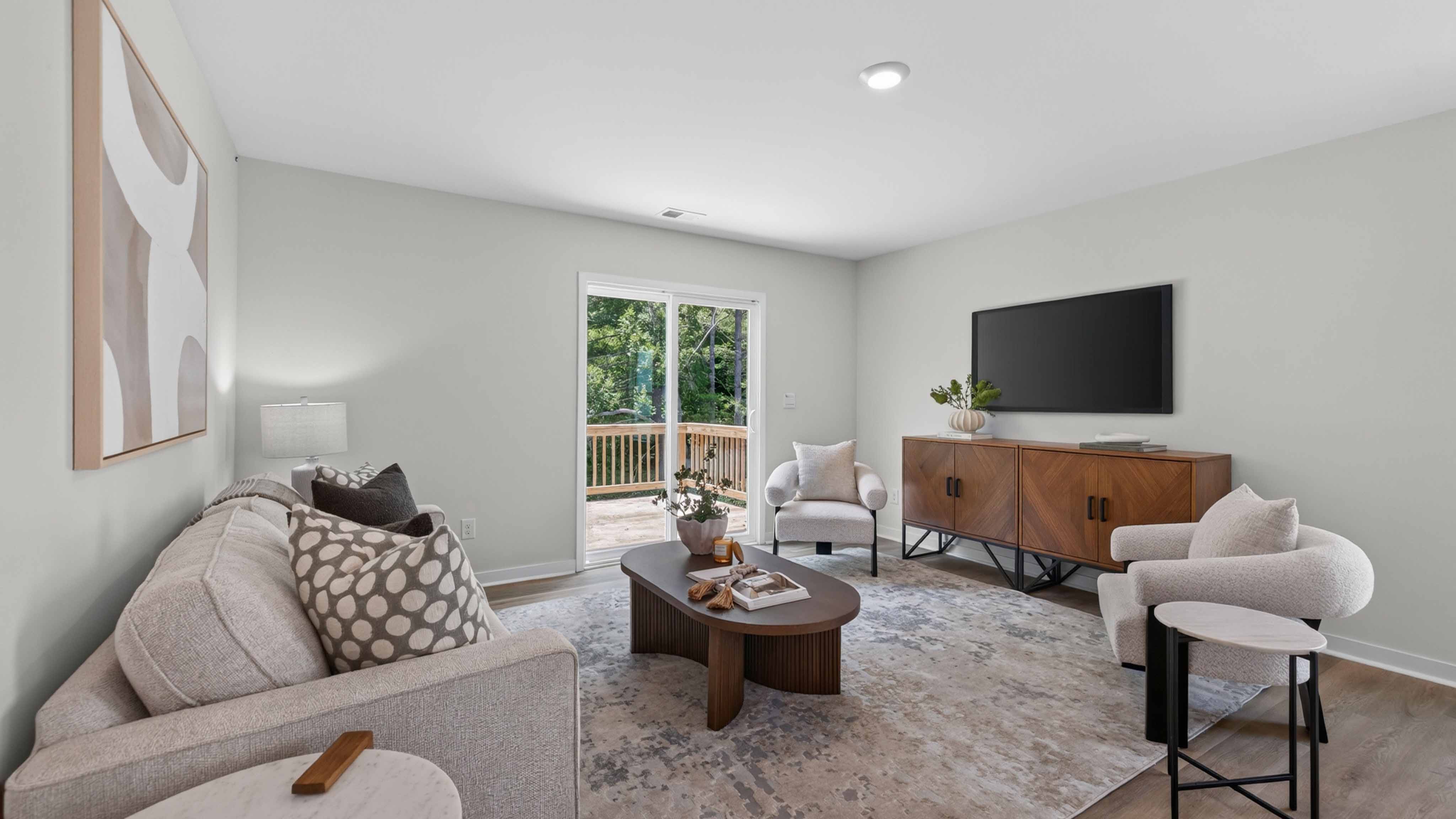 Family room with fireplace and large window