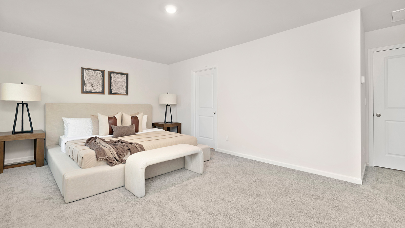 Primary bedroom, carpeted with two large windows